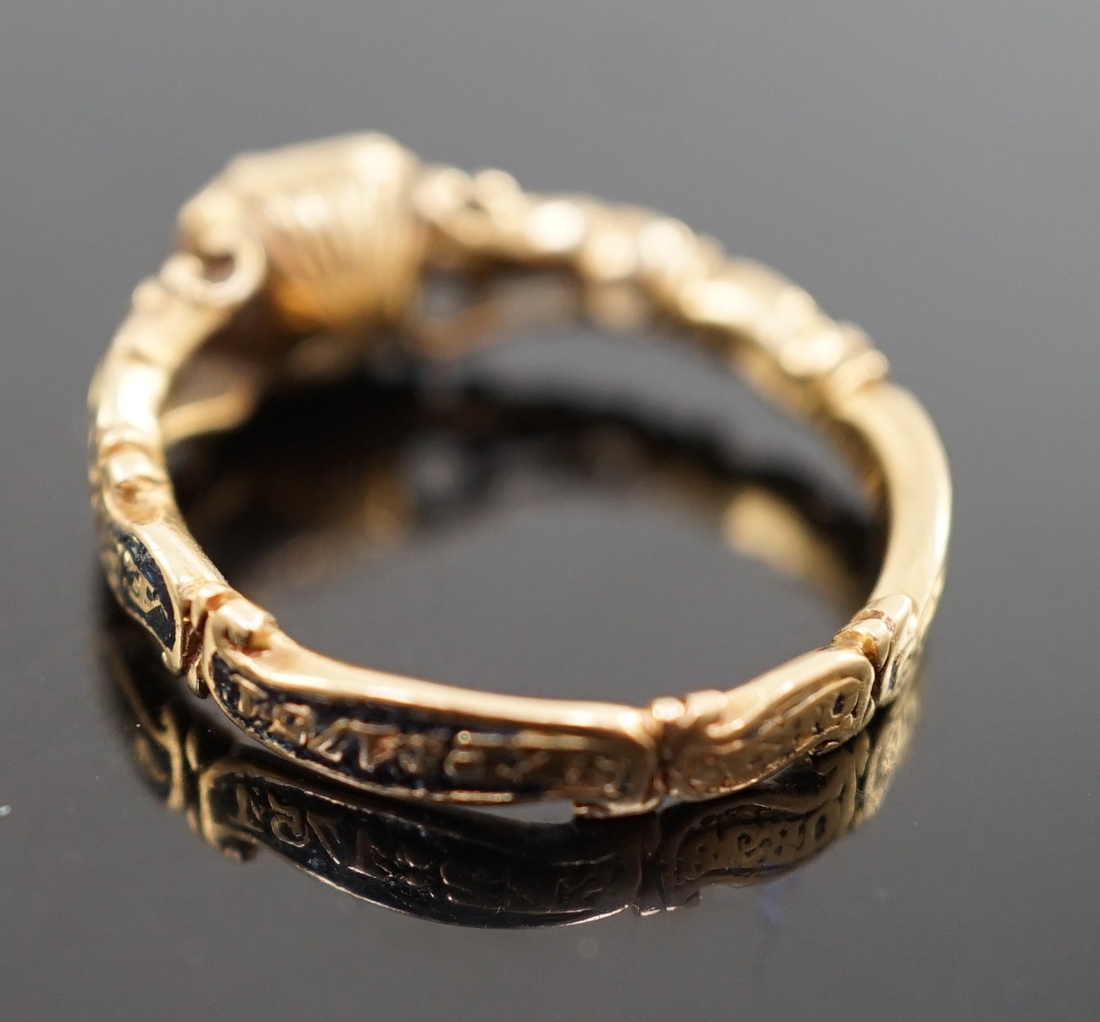 A George II gold, black enamel and rock crystal set mourning ring